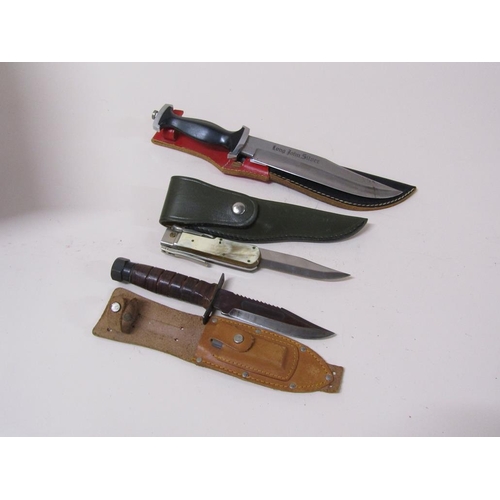 1550 - THREE HUNTING KNIVES IN LEATHER SHEATHS