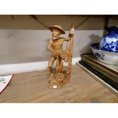 108 - CARVED ORIENTAL FIGURE OF A FISHERMAN