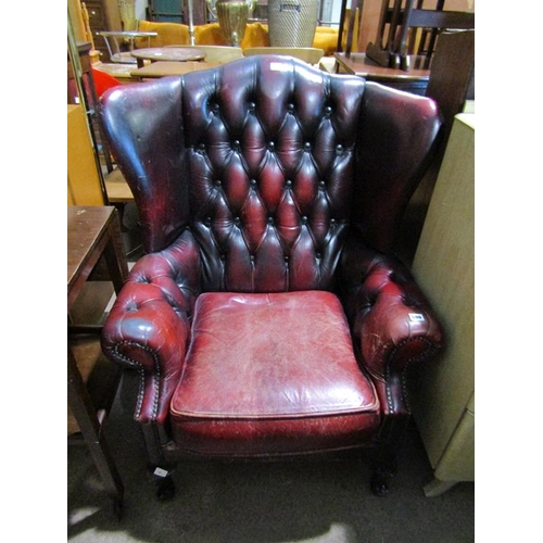 590 - LEATHER WING BACKED ARMCHAIR