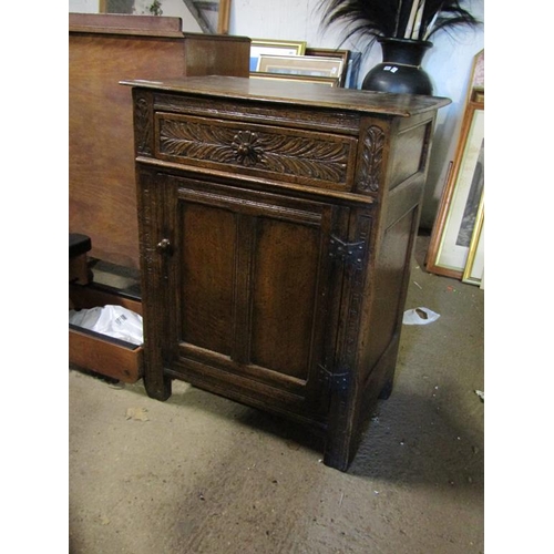 673 - EARLY 20C CARVED OAK CUPBOARD