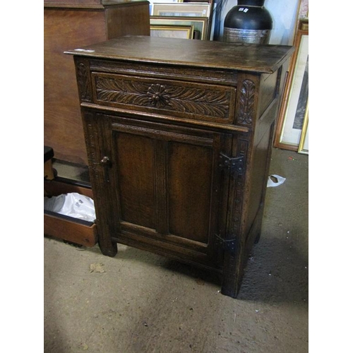 673 - EARLY 20C CARVED OAK CUPBOARD