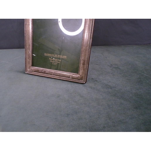 1694 - HARRODS SILVER PHOTO FRAME, INSCRIBED TO MAGGIE AND JOHN