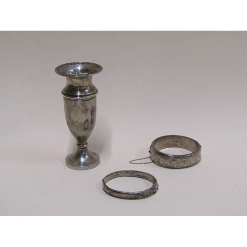 1514 - TWO SILVER ENGINE TURNED BANGLES AND A SMALL SILVER VASE WITH WEIGHTED BASE