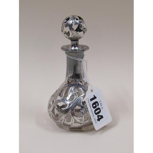 1604 - SILVER OVERLAID GLASS SCENT BOTTLE AND STOPPER