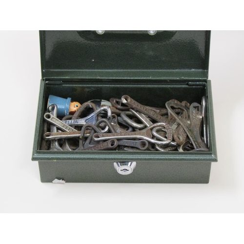 1653 - TIN OF BOTTLE OPENERS