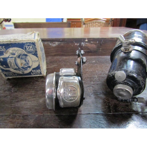 1363 - EARLY 20c CARBIDE CYCLE LAMP TOGETHER WITH A MOTORBIKE REAR LAMP AND A BRASS OBJECT