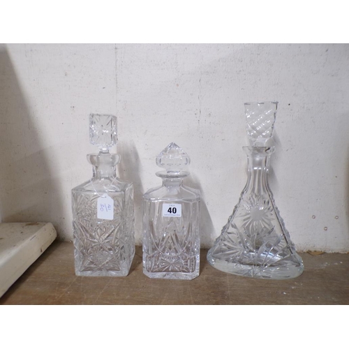 40 - THREE CRYSTAL DECANTERS