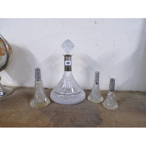 49 - SILVER COLLARED CRYSTAL DECANTER; THREE SCENT BOTTLES