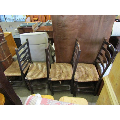 859 - FOUR RUSH SEATED LADDER BACK CHAIRS