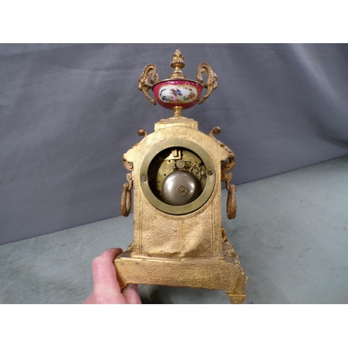 1490 - FRENCH GILT METAL MANTEL CLOCK WITH URN FINIAL PAINTED CERAMIC FACE AND PANELS. 34cms H