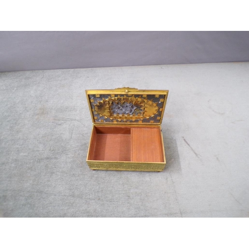 1508 - CONTINENTAL GILT METAL MUSICAL CIGARETTE BOX - 15cms W