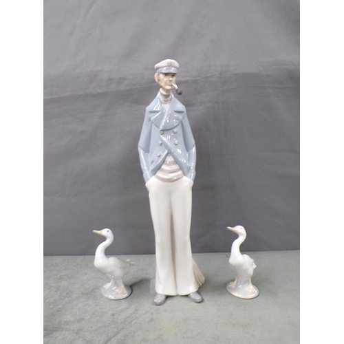 1837 - TWO LLADRO DUCKS; PORCELAIN FISHERMAN, 35CM H