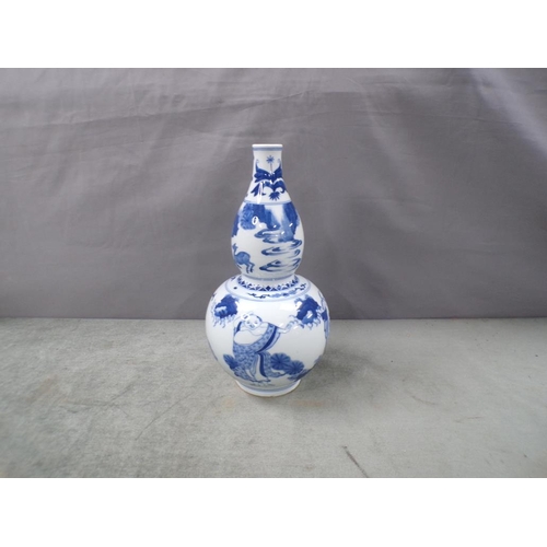 1900 - ORIENTAL BLUE AND WHITE DOUBLE GOURD VASE, 30cms H