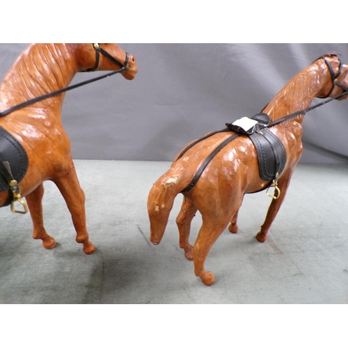 1357 - THREE LEATHER MODEL HORSES WITH SADDLES, EACH APPROX 37CM W