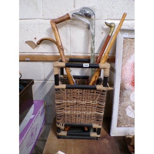 352 - WICKER BASKET TO INCL WALKING STICKS