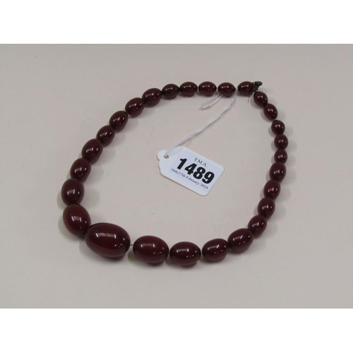 1489 - STRING OF CHERRY AMBER TYPE BEADS