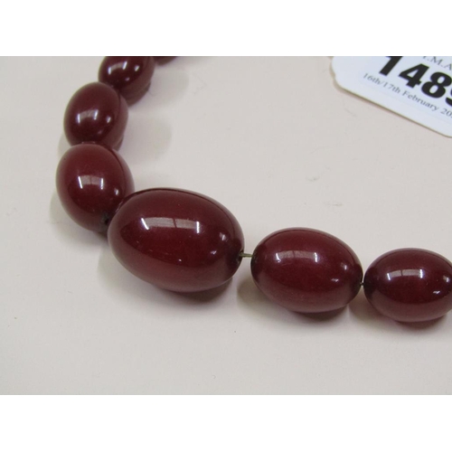 1489 - STRING OF CHERRY AMBER TYPE BEADS