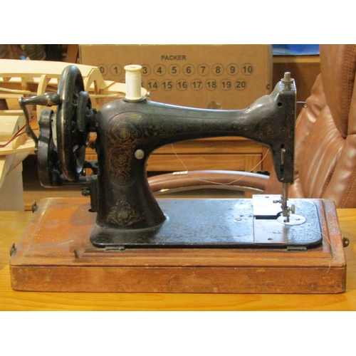 561 - SADDLE RACK AND A SEWING MACHINE