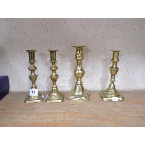 72 - TWO PAIRS OF BRASS CANDLESTICKS