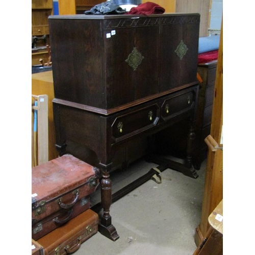 759 - JAMES SHOOLBRED OAK DINING CABINET ON STAND