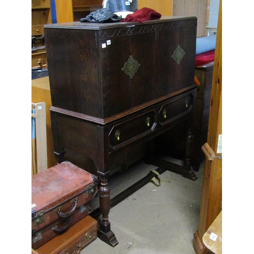 759 - JAMES SHOOLBRED OAK DINING CABINET ON STAND