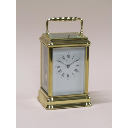 16 - A late 20c French carriage clock in glazed brass 'Gorge' case, the white rectangular dial having Rom... 