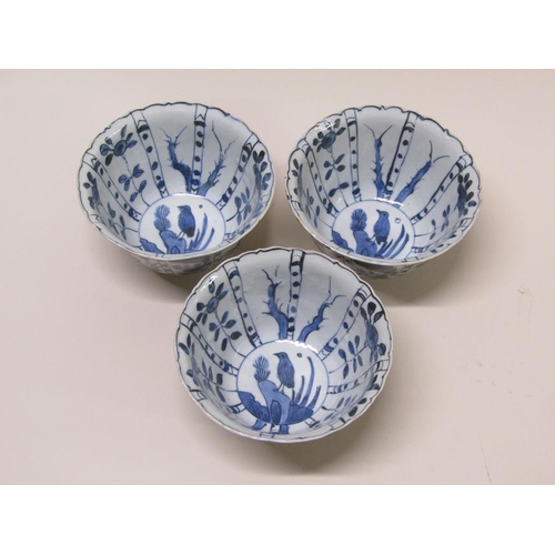 175 - Three Chinese Kraak style blue on white decorated bowls, 13cm diam.