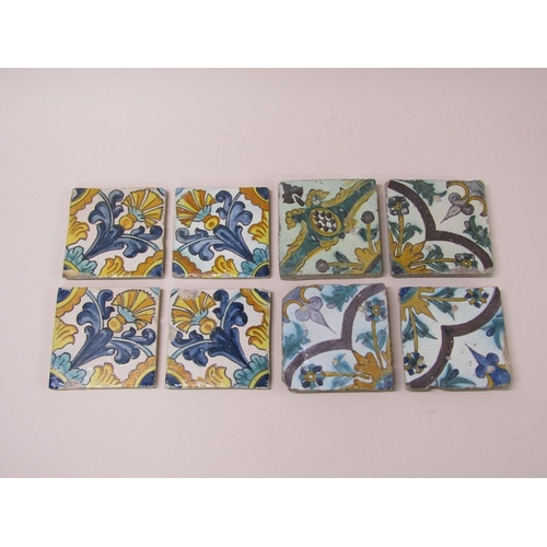 185 - Two sets of four Spanish polychrome tiles of leaf and floral design, principally glazed in yellow gr... 