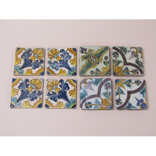 185 - Two sets of four Spanish polychrome tiles of leaf and floral design, principally glazed in yellow gr... 