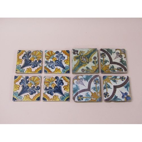 185 - Two sets of four Spanish polychrome tiles of leaf and floral design, principally glazed in yellow gr... 