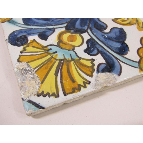 185 - Two sets of four Spanish polychrome tiles of leaf and floral design, principally glazed in yellow gr... 