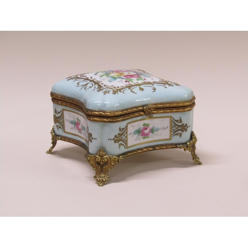 191 - A French Limoges porcelain casket box, hand painted with flowers and gilded with gilt metal mounts, ... 