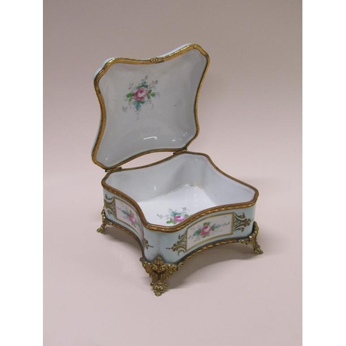 191 - A French Limoges porcelain casket box, hand painted with flowers and gilded with gilt metal mounts, ... 