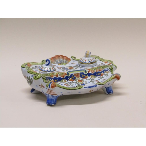 193 - A French faience inkstand with floral decoration and shell motif, 20cm w- one well missing.