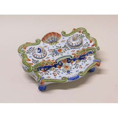 193 - A French faience inkstand with floral decoration and shell motif, 20cm w- one well missing.