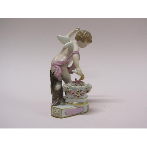 195 - A 19c Meissen porcelain figure of a cupid forging hearts, raised on a rectangular base, titled 'Je l... 