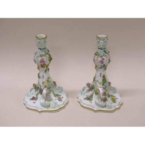 196 - A pair of late 19c/early 20c Meissen flower encrusted porcelain candlesticks, gilt decorated and han... 