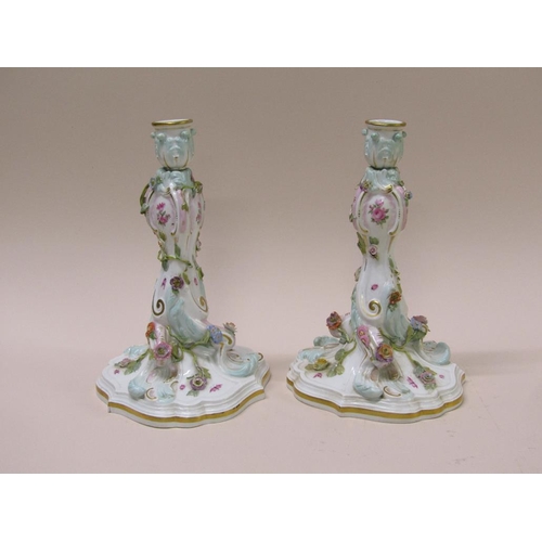 196 - A pair of late 19c/early 20c Meissen flower encrusted porcelain candlesticks, gilt decorated and han... 