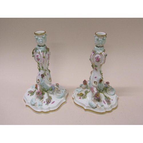 196 - A pair of late 19c/early 20c Meissen flower encrusted porcelain candlesticks, gilt decorated and han... 