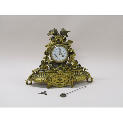 21 - A late 19c French mantel clock in ornate gilt spelter case, the 9cm white enamel dial surrounded by ... 