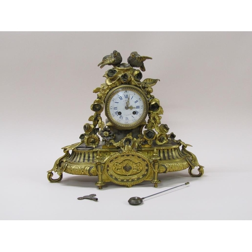 21 - A late 19c French mantel clock in ornate gilt spelter case, the 9cm white enamel dial surrounded by ... 