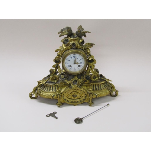 21 - A late 19c French mantel clock in ornate gilt spelter case, the 9cm white enamel dial surrounded by ... 