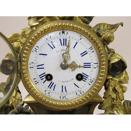 21 - A late 19c French mantel clock in ornate gilt spelter case, the 9cm white enamel dial surrounded by ... 