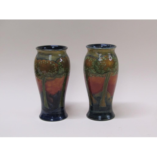 217 - A pair of early 20c Moorcroft Eventide vases of baluster form, impressed and signed to base, each 22... 