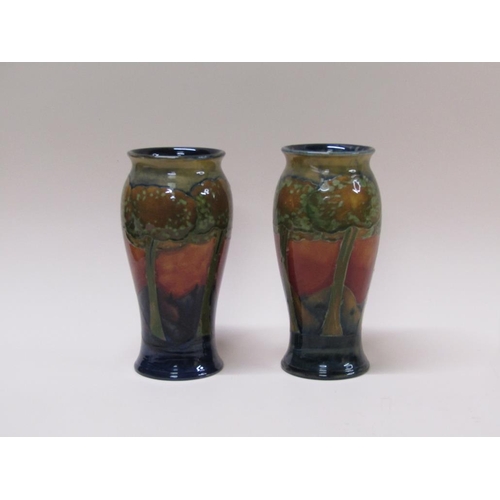 217 - A pair of early 20c Moorcroft Eventide vases of baluster form, impressed and signed to base, each 22... 