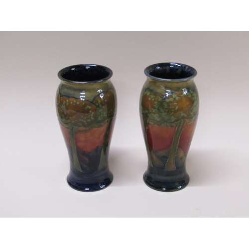 217 - A pair of early 20c Moorcroft Eventide vases of baluster form, impressed and signed to base, each 22... 