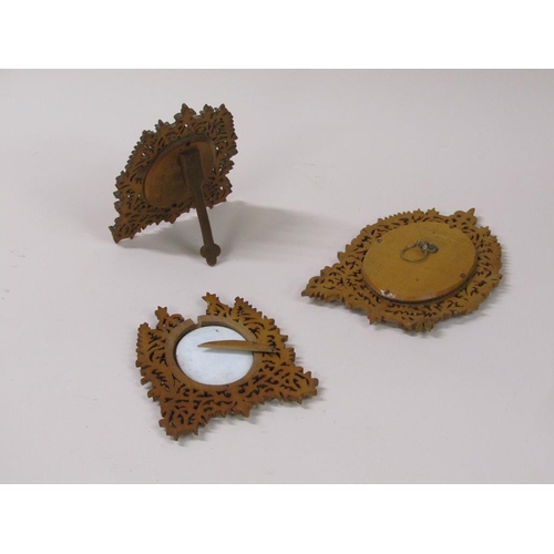 66 - Three 19c oval porcelain plaques, two of cherubs, 6cm x 5cm, and one of a lady reading a book, 8cm x... 