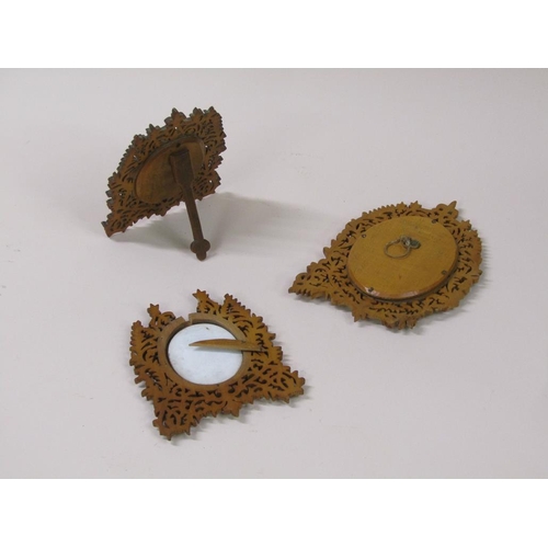 66 - Three 19c oval porcelain plaques, two of cherubs, 6cm x 5cm, and one of a lady reading a book, 8cm x... 