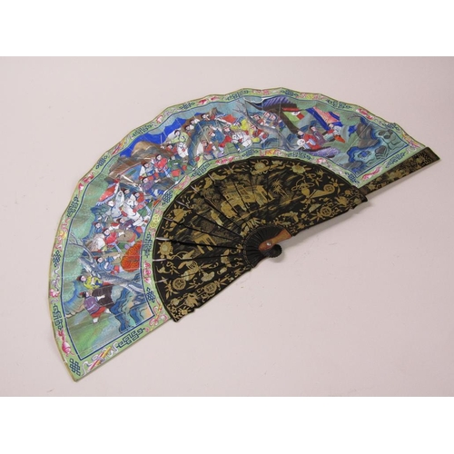 68 - A Japanese Meiji period hand fan with black lacquered sticks, gilt chinoiserie painted and having pa... 