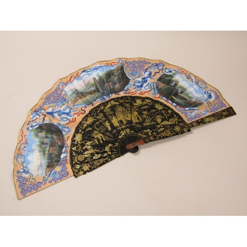 68 - A Japanese Meiji period hand fan with black lacquered sticks, gilt chinoiserie painted and having pa... 